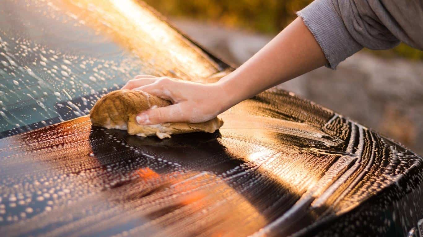 Hand washing black car