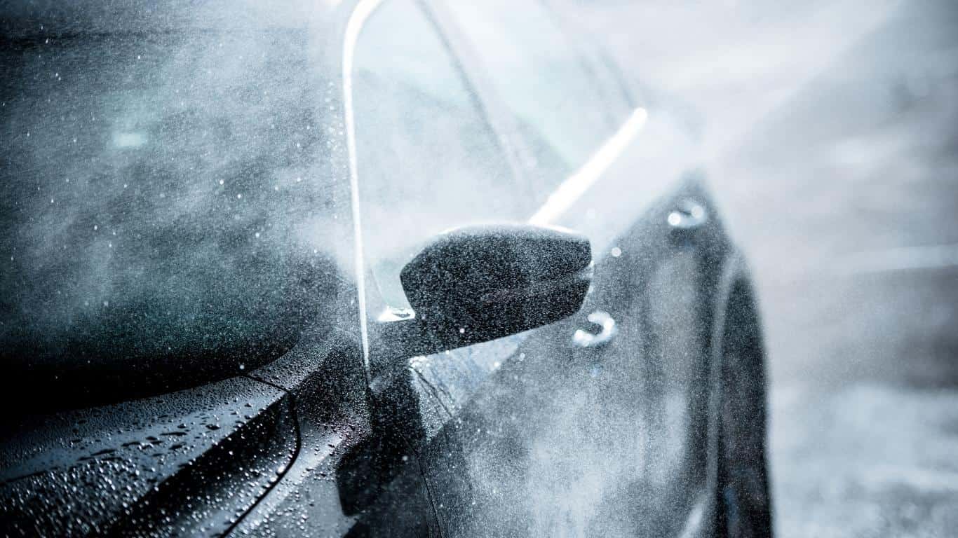 Hosing down a black car