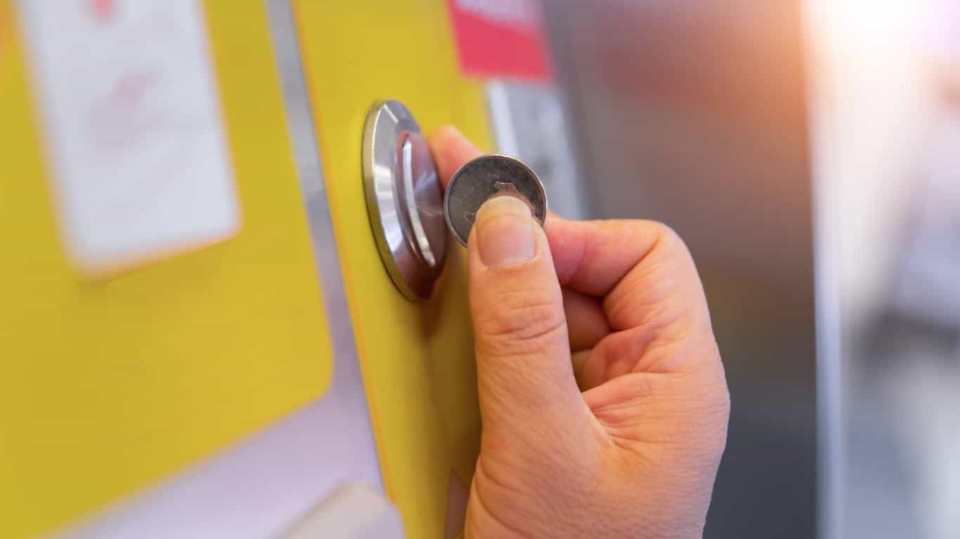 Inserting a coin into a machine